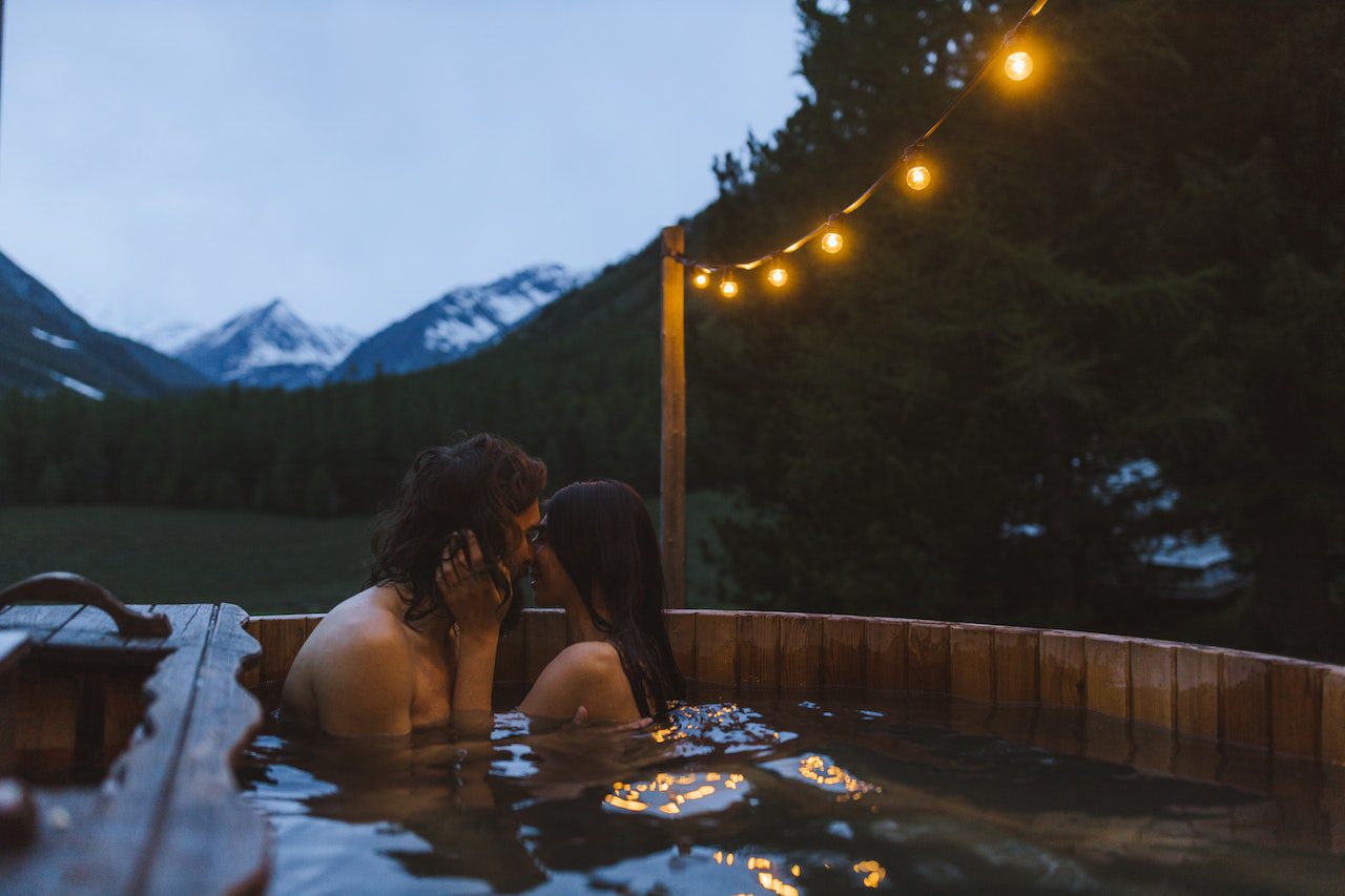 A couple kissing in a swimming pool