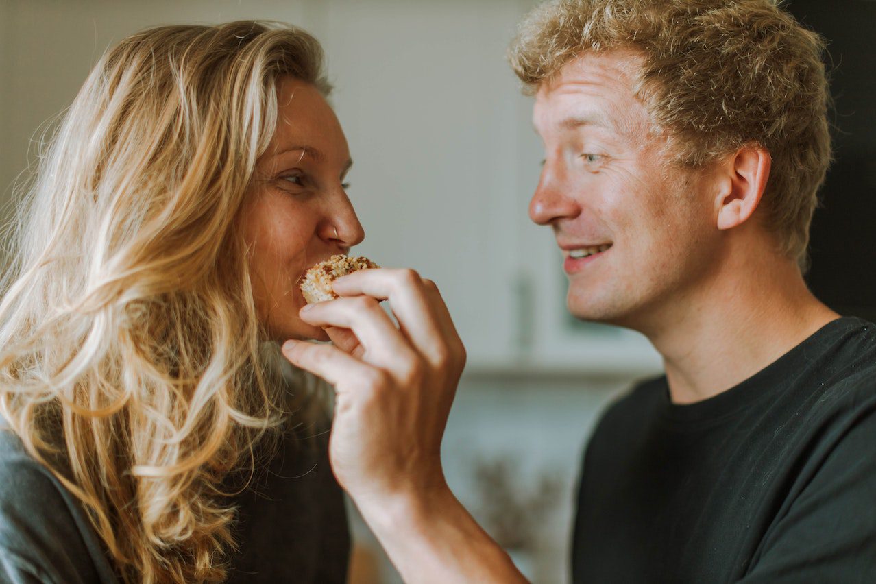 A couple having fun at breakfast.